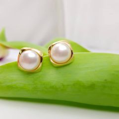 grote oorbelknop in goud